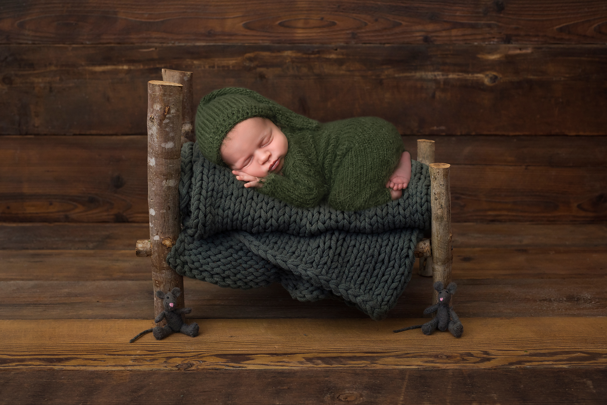 newborn baby on wooden bed in York