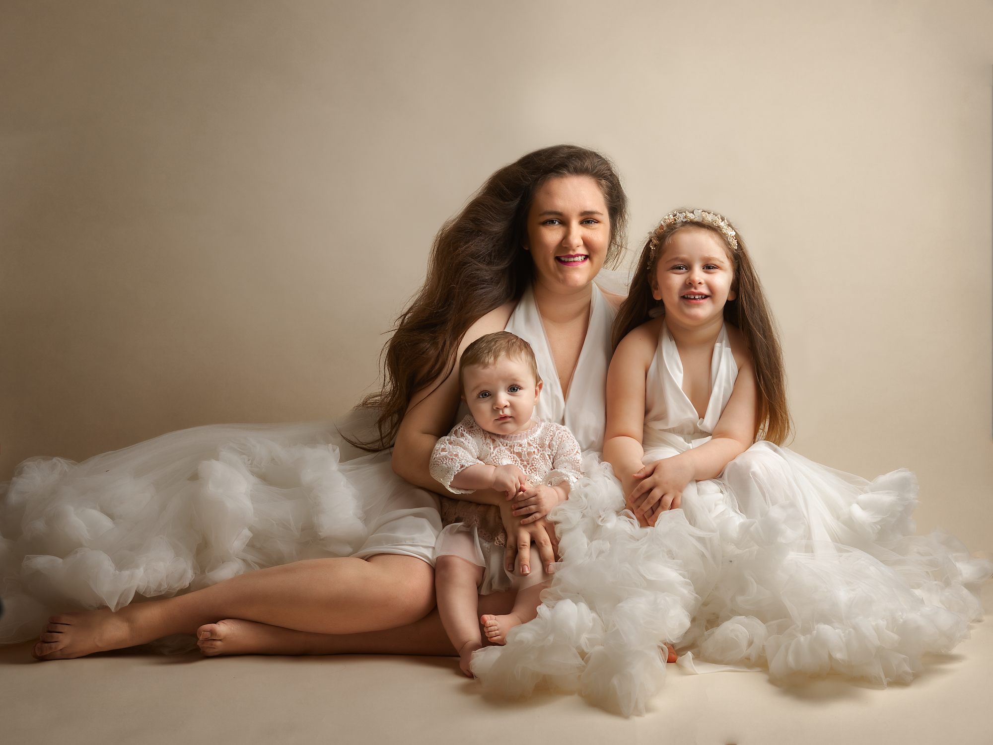 mum and daughters wearing white dresses