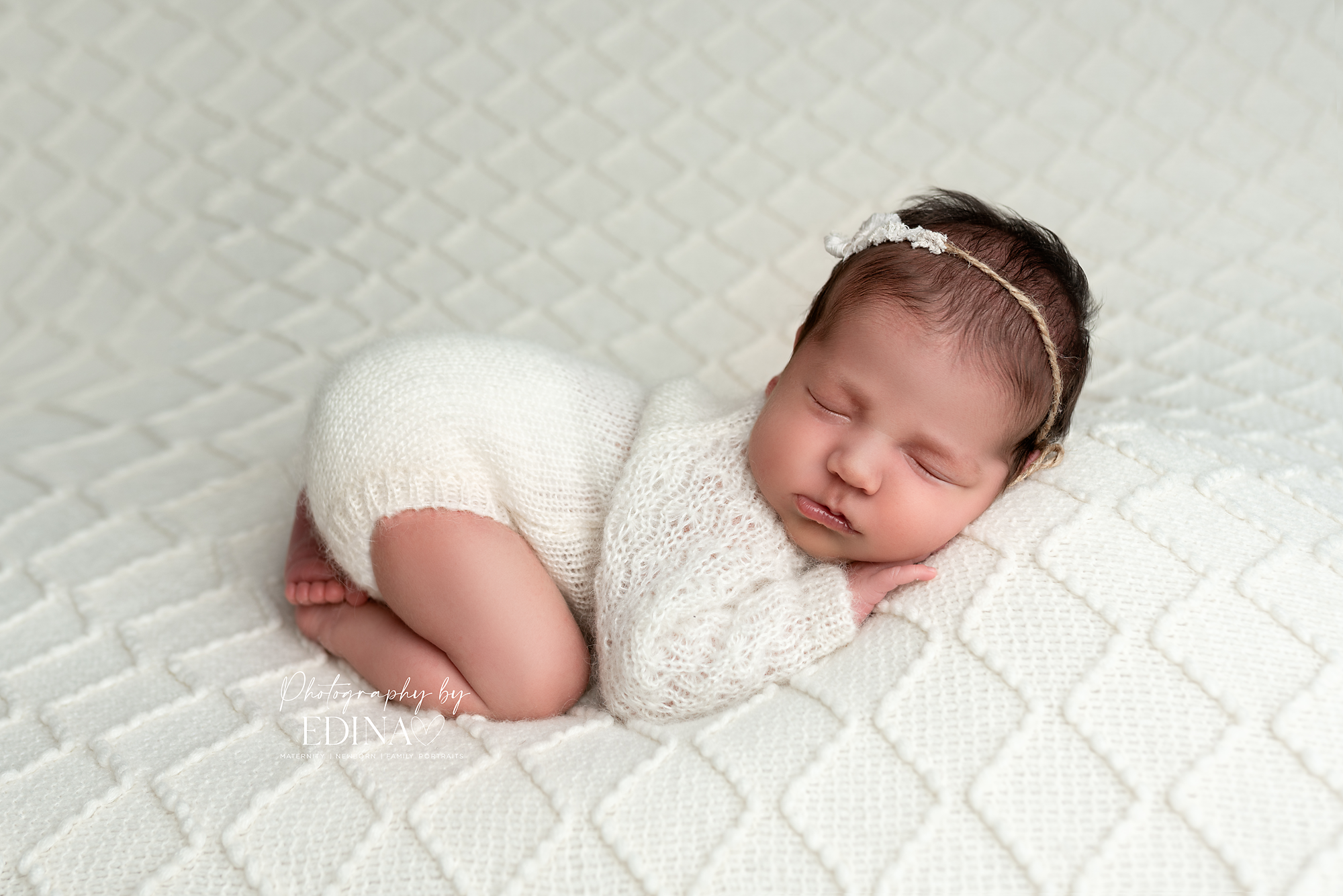 newborn girl posing during a photo shoot