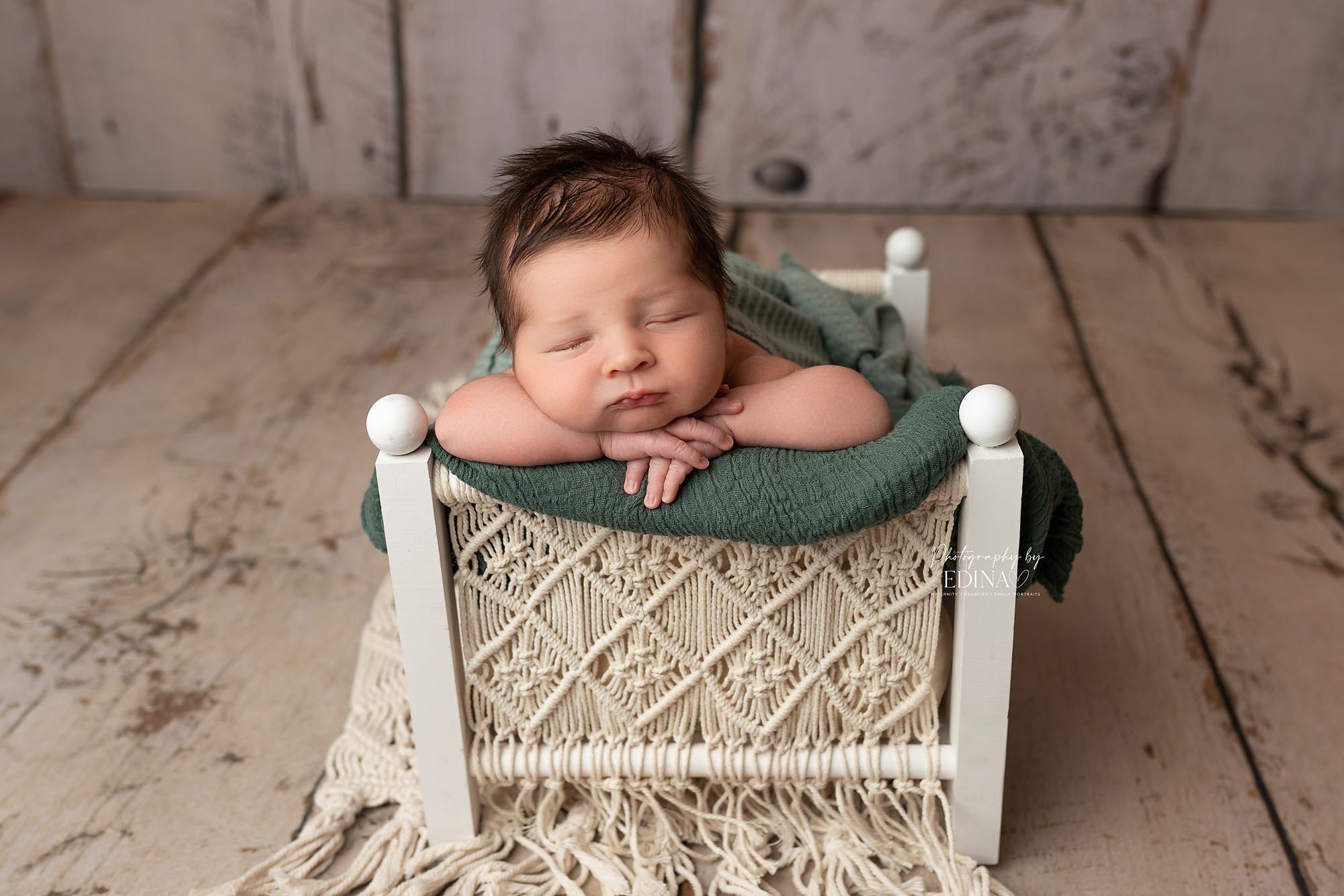 baby posing on a newborn bed in York