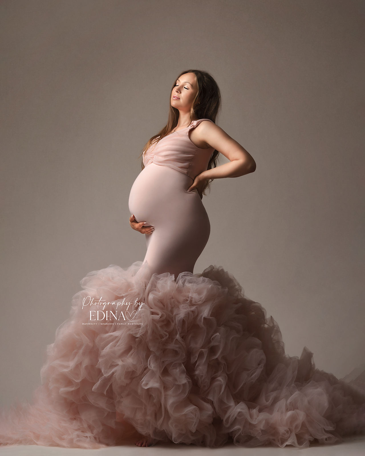 pregnant lady posing in a pink dress in York