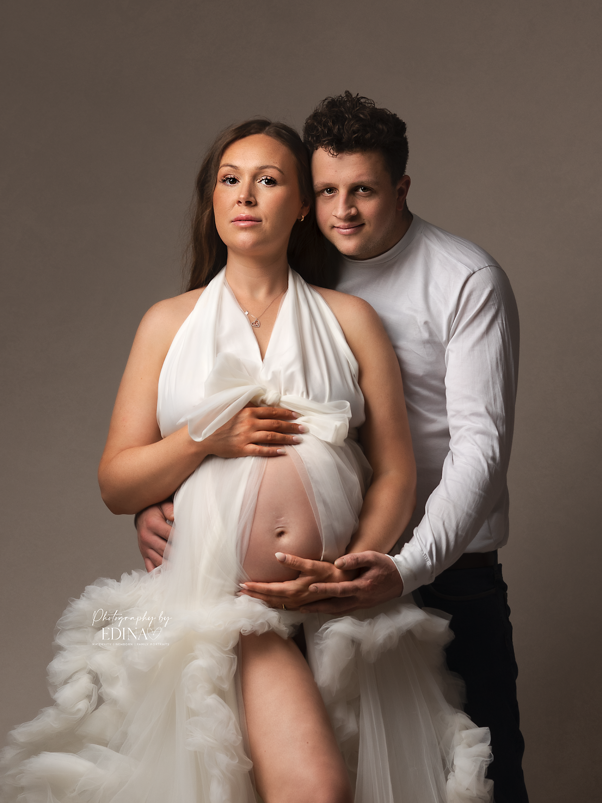 pregnant couple posing in a maternity session in York